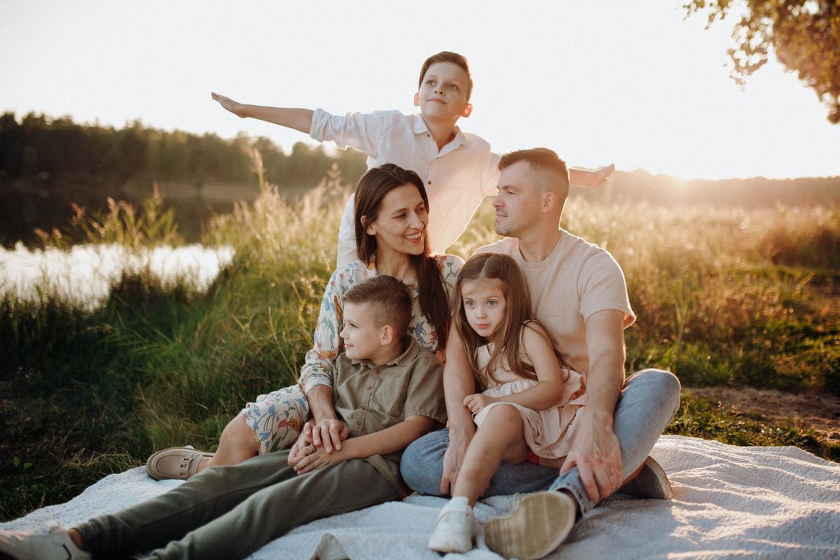 A family enjoying time together outdoors at sunset