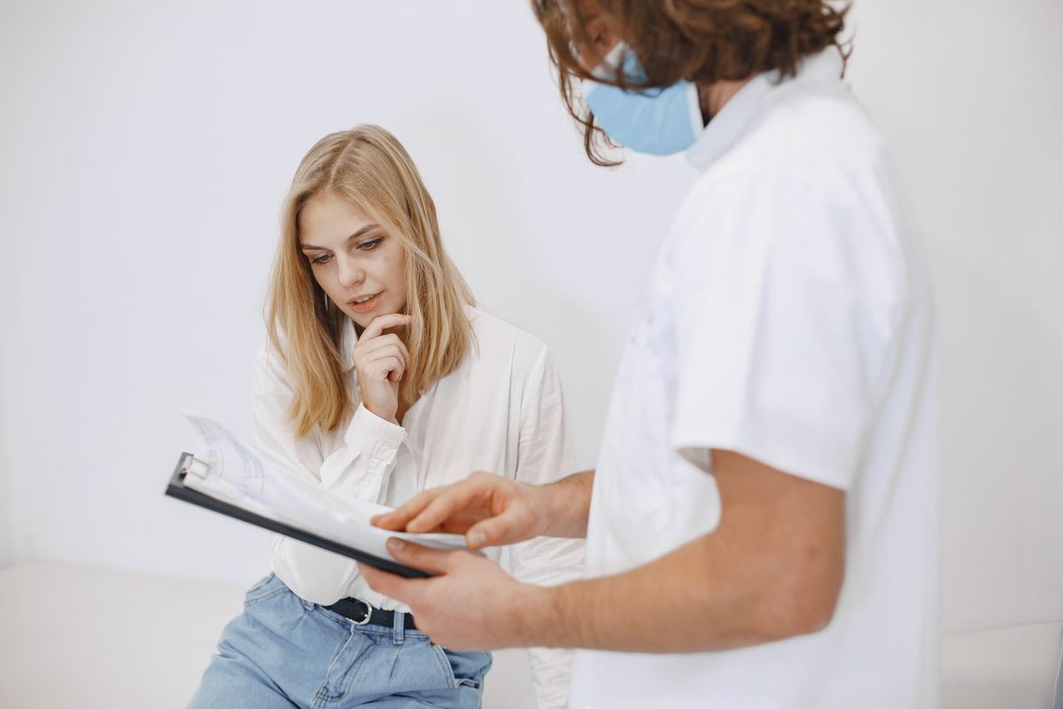 A physician getting to know a patient and their health history